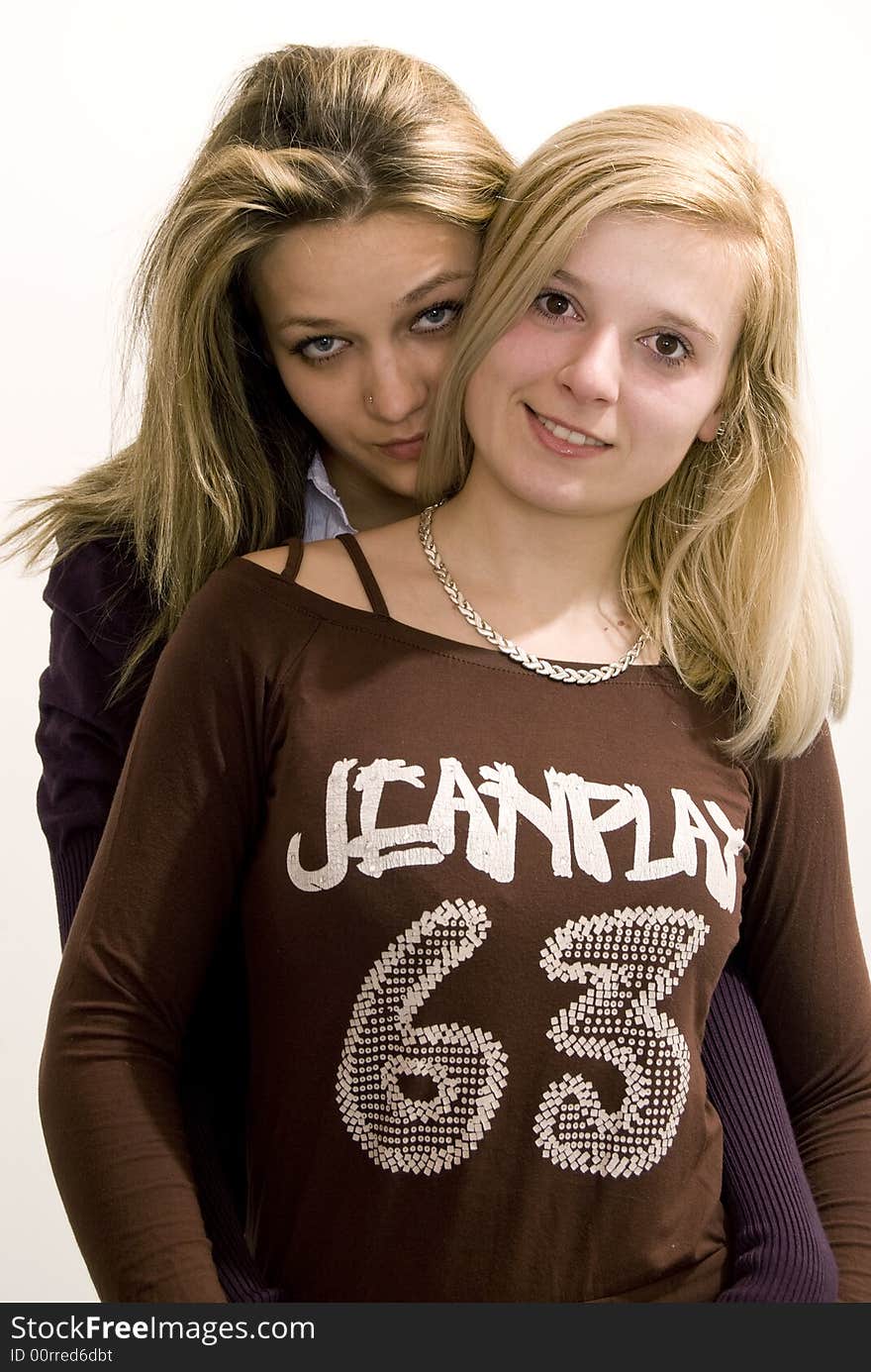 Girls posing together in studio. Girls posing together in studio