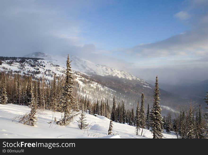 Alpine slope covered with snow