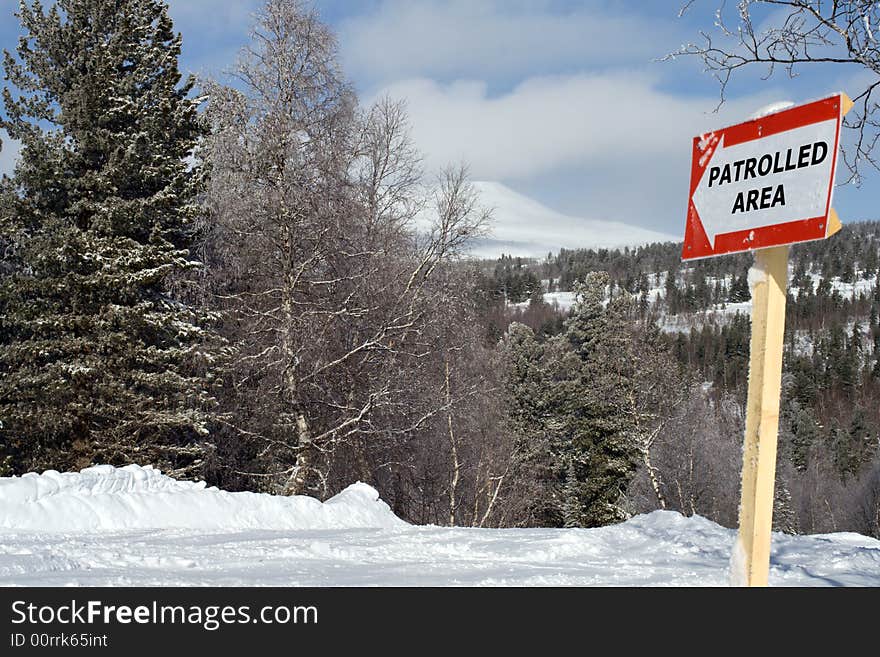 Sign patrolled area on mountain slope for ski and snowboarding freeride. Sign patrolled area on mountain slope for ski and snowboarding freeride