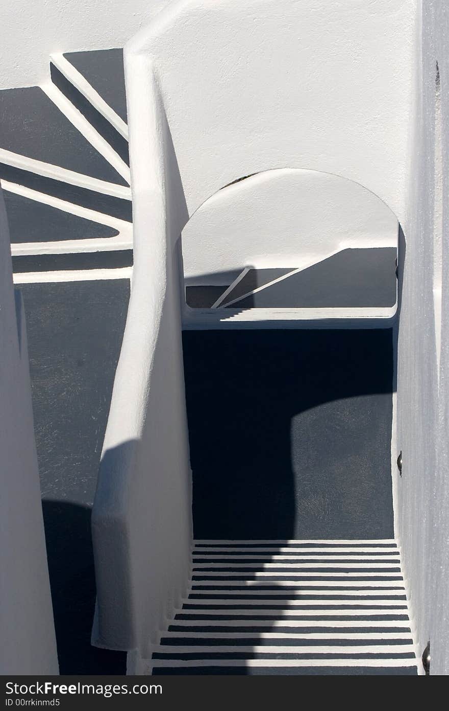 An outside stairway in a typical Greek hotel. Plenty of stairs going in many different directions, in a hotel built upon a cliff. An outside stairway in a typical Greek hotel. Plenty of stairs going in many different directions, in a hotel built upon a cliff