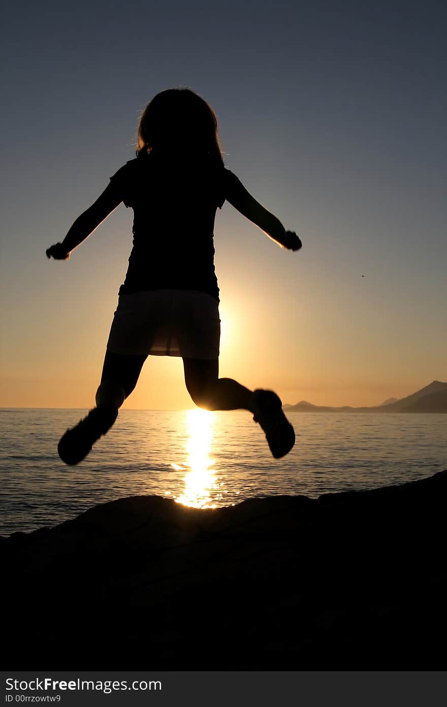 Silhouette of jumping girl