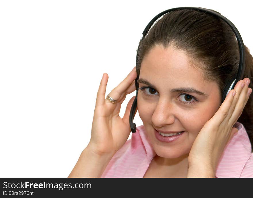 A girl, wearing headphones and microphone, smiling, looking very satisfied. A girl, wearing headphones and microphone, smiling, looking very satisfied