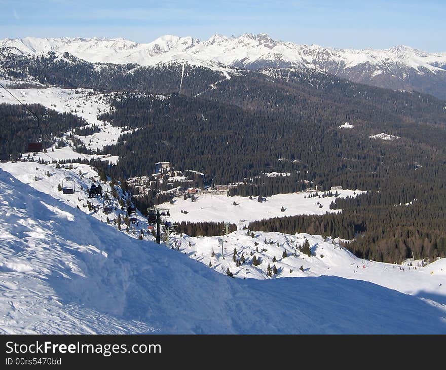 Beautiful snowscape with slope and trees