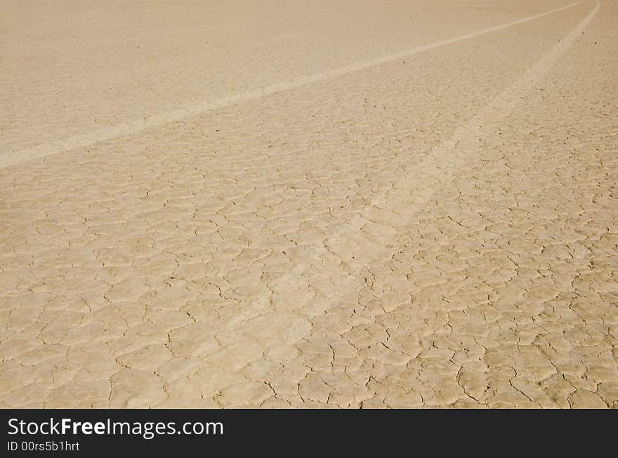 Tires track on dry lake, nevada