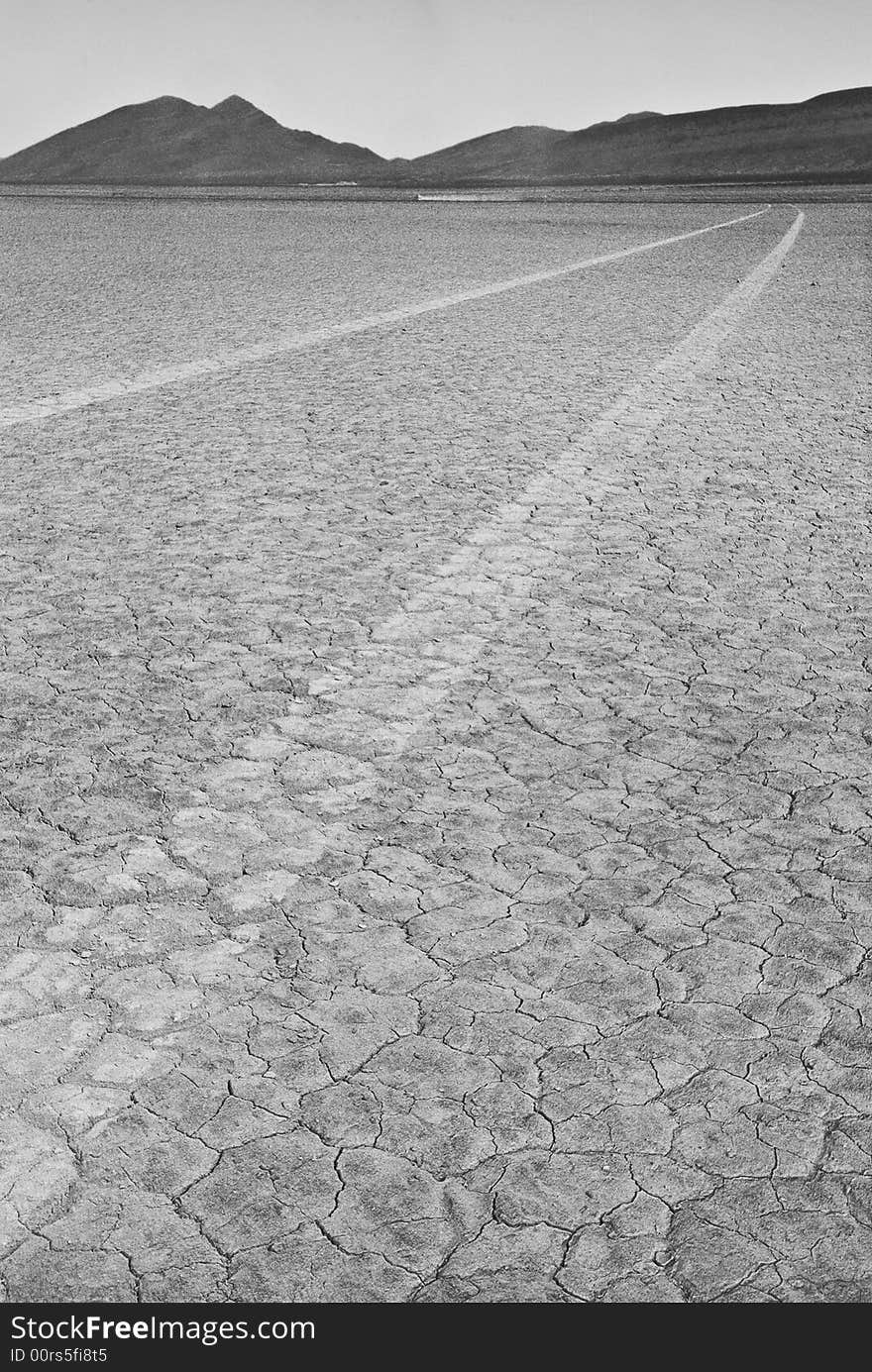 Tires track on dry lake