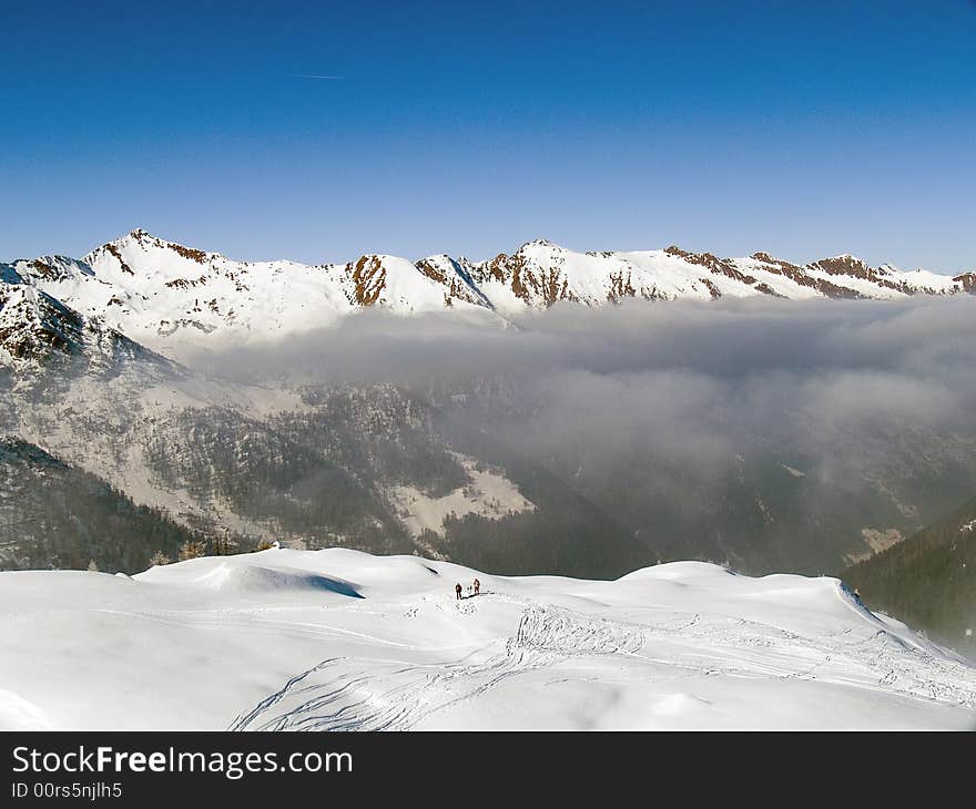 On the top of a mountain above the clouds