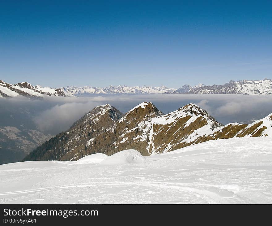 On the top of a mountain above the clouds