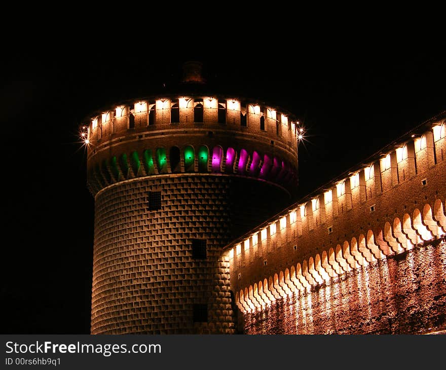 A tower of Castello Sforzesco in Milan by night. A tower of Castello Sforzesco in Milan by night