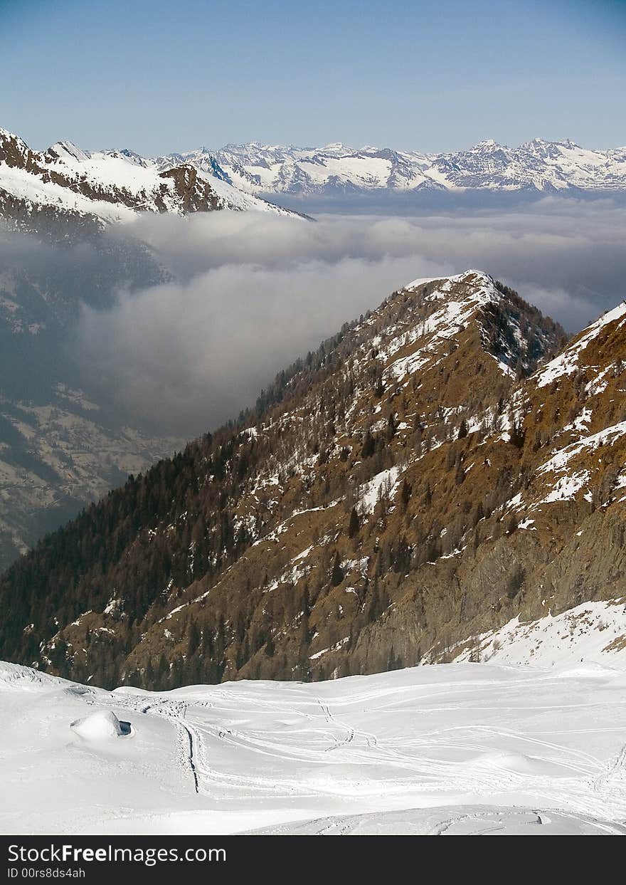 On the top of a mountain above the clouds