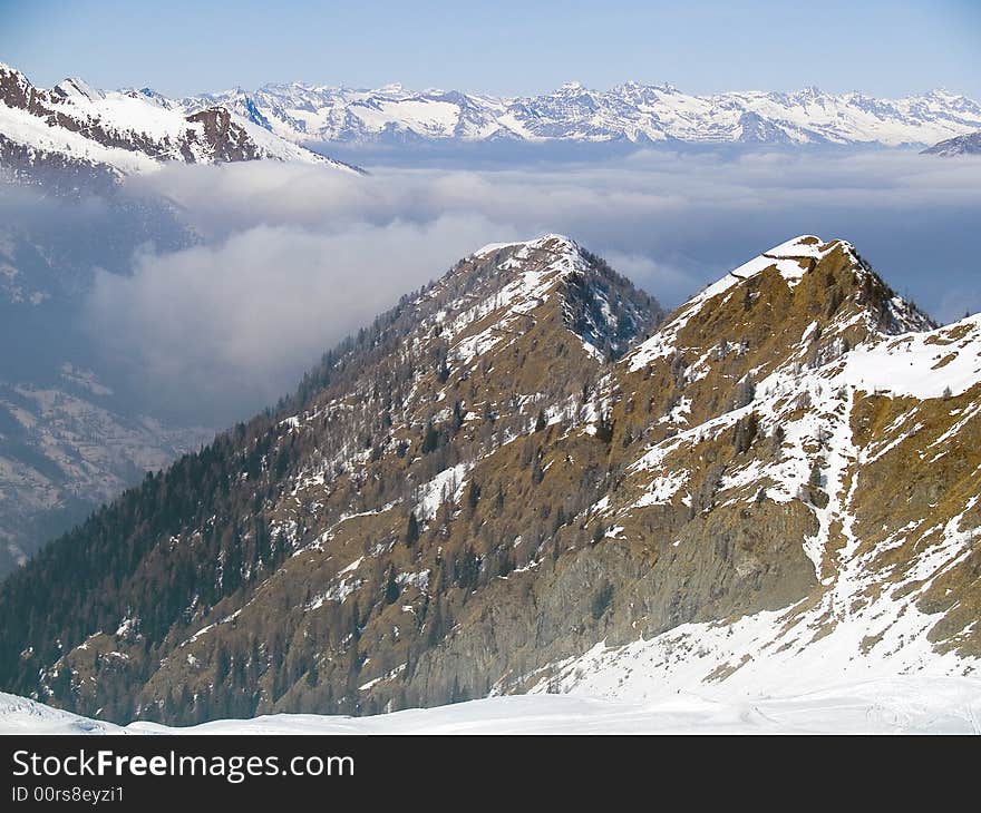 On the top of a mountain above the clouds