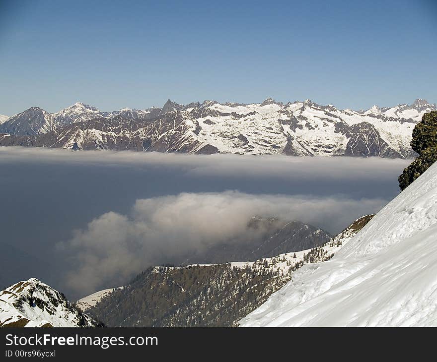 On the top of a mountain above the clouds