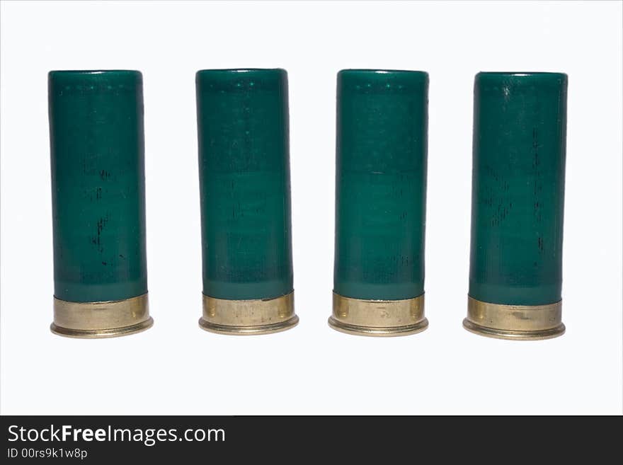 4 shot gun cartridges standing up side by side. 4 shot gun cartridges standing up side by side