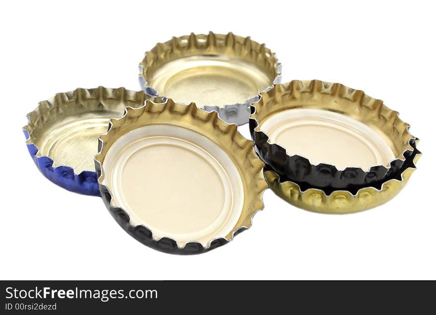 Different lids from beer on white background