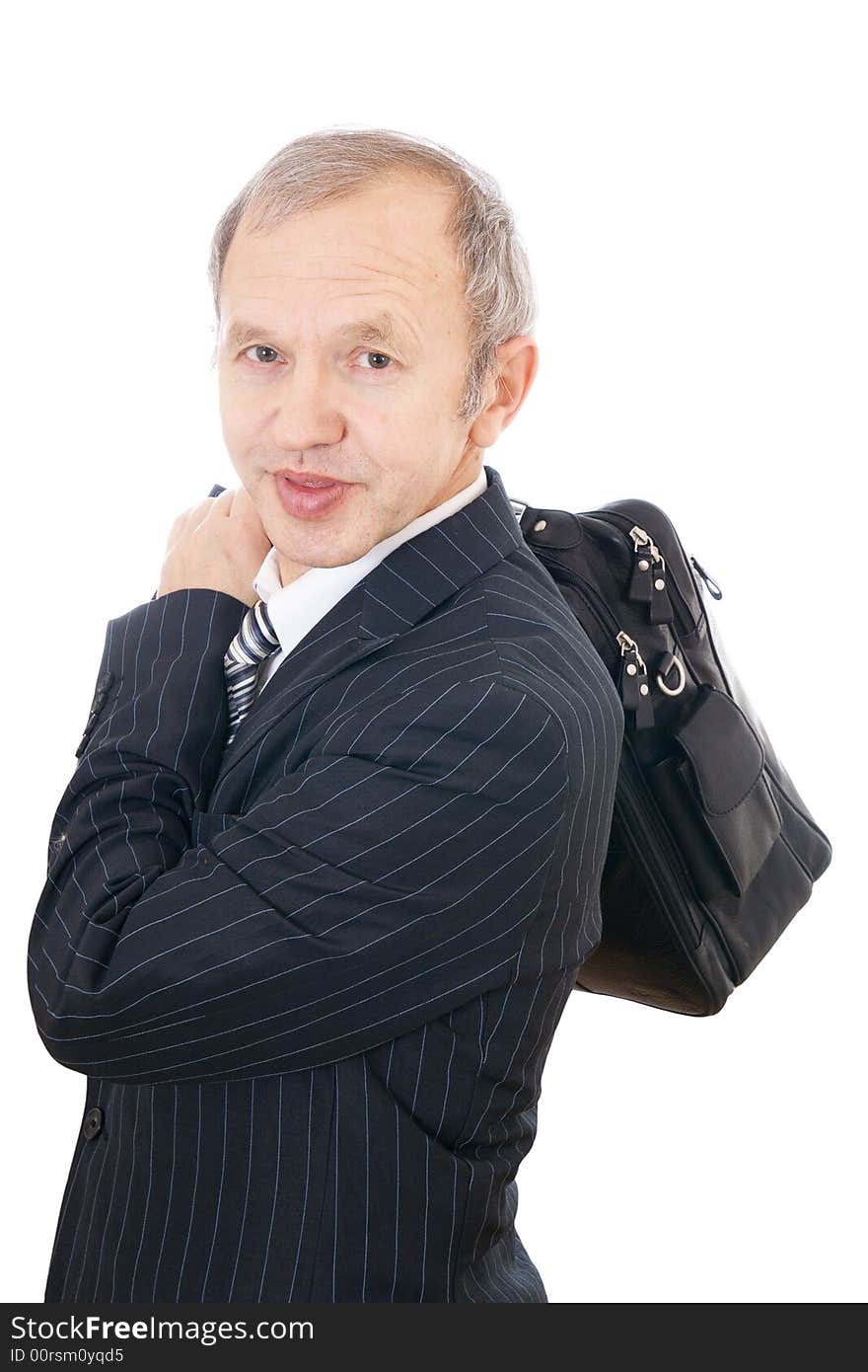 The adult businessman with a bag isolated on a white background. The adult businessman with a bag isolated on a white background