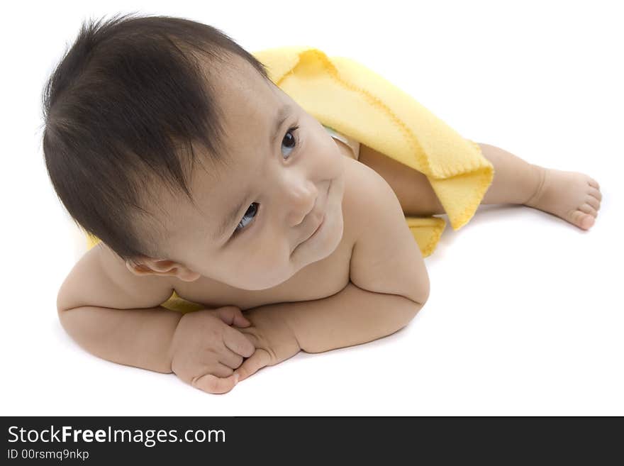 Charming baby with yellow soft cover before white background