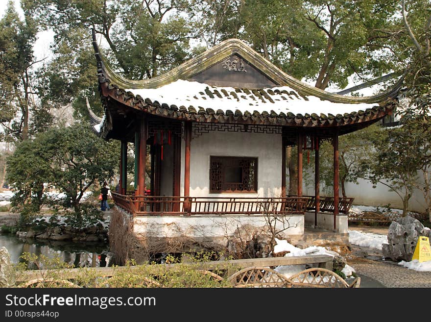 The  roof of an ancient pavilion decoated with snow.This picture is taken in Zhuozheng park in Suzhou ,China. The  roof of an ancient pavilion decoated with snow.This picture is taken in Zhuozheng park in Suzhou ,China