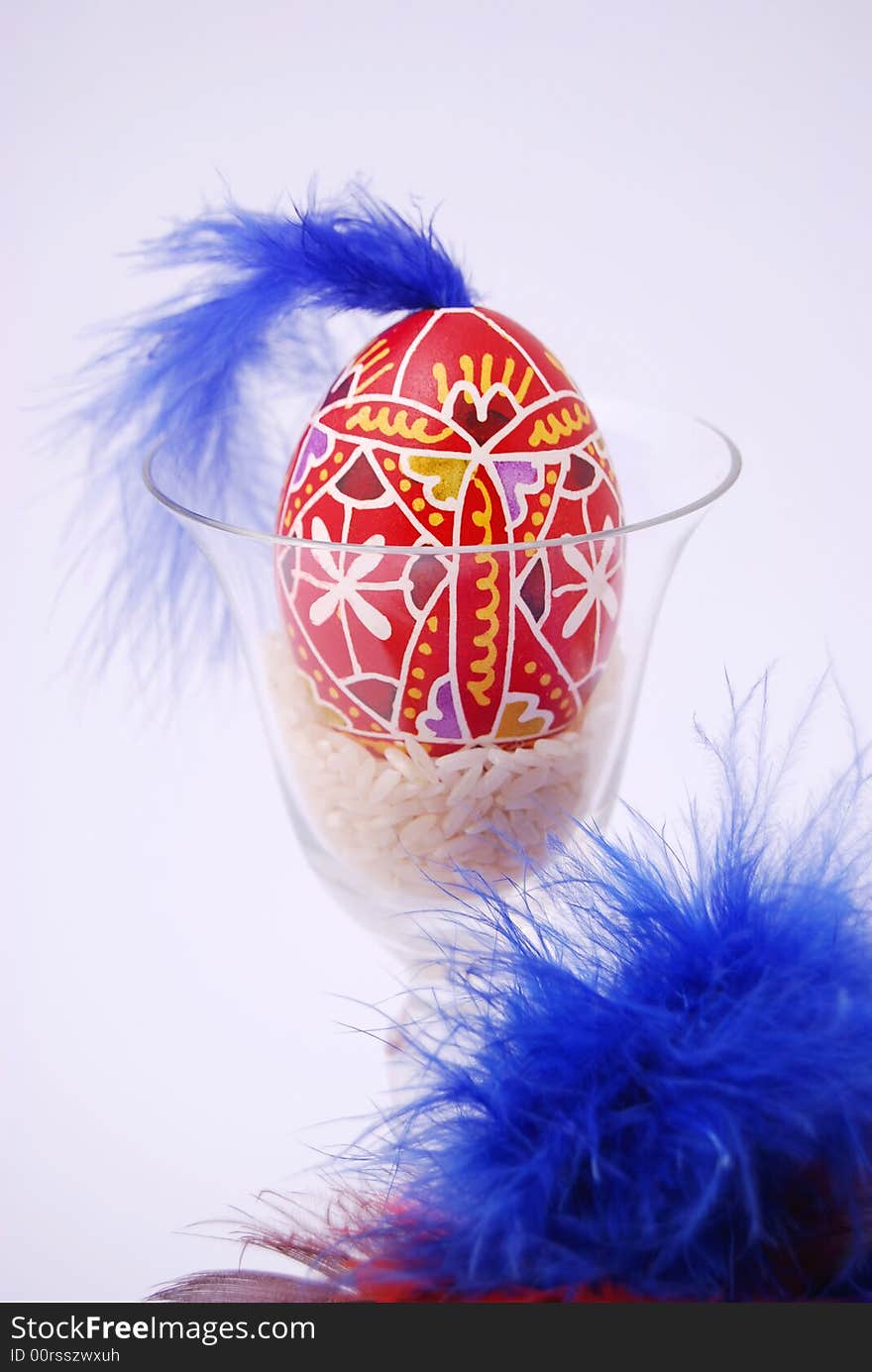 Easter egg with plumage and glass