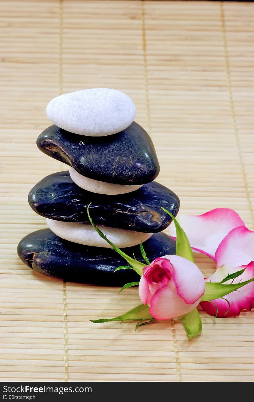 Some stones arranged on a wooden mat. Some stones arranged on a wooden mat.