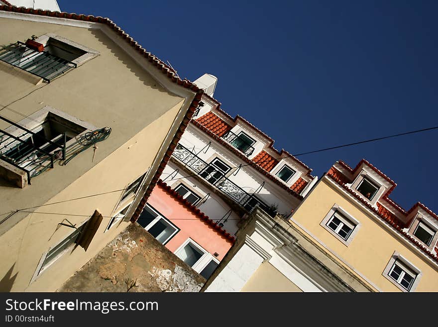 A mass of housing clinging to the Lisbon hillsides of Portugal. A mass of housing clinging to the Lisbon hillsides of Portugal