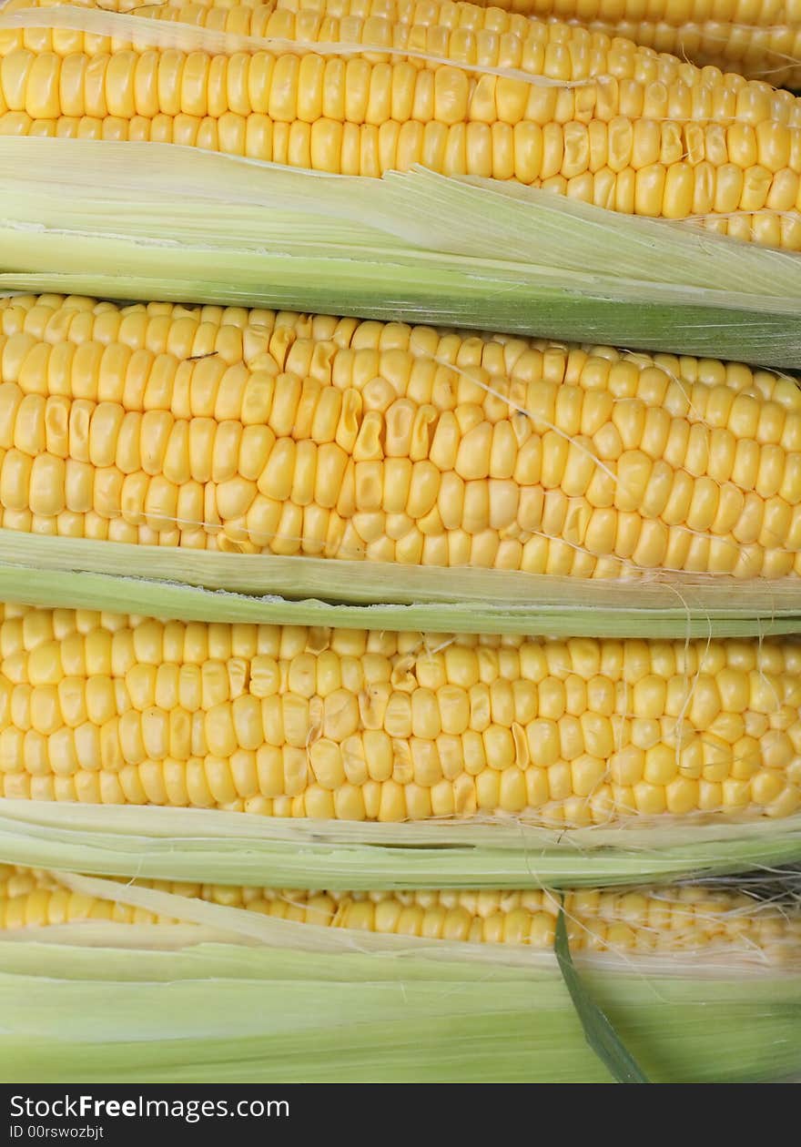 Detail image of some corn cobs  in a vegetables market