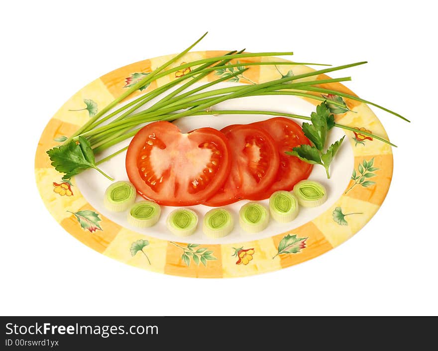 Fresh, early vegetables on oval plate