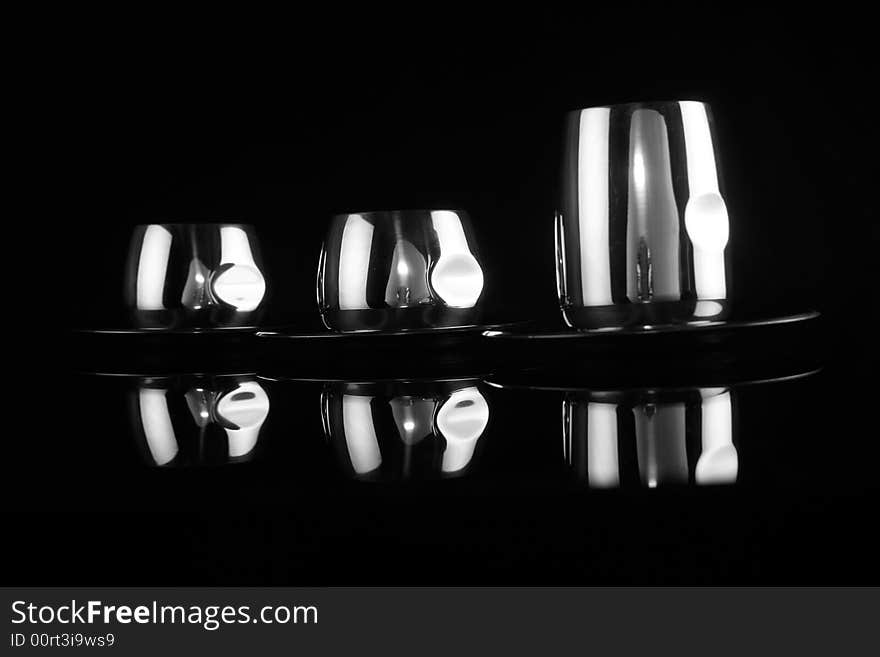 Black and white metal chrome cups for coffee. Black and white metal chrome cups for coffee