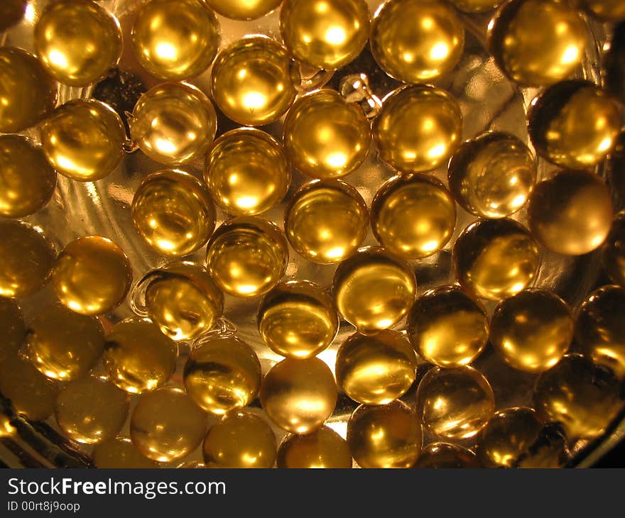 Close-up of gel gold capsules containing oil