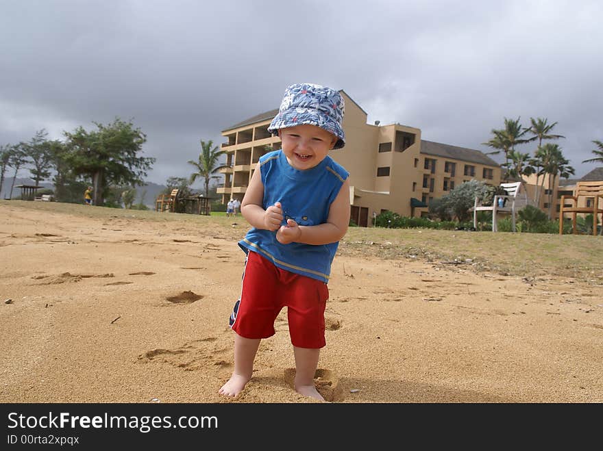 Little boy on sandy beach , holiday