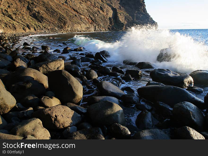 Sea waves on stony coast