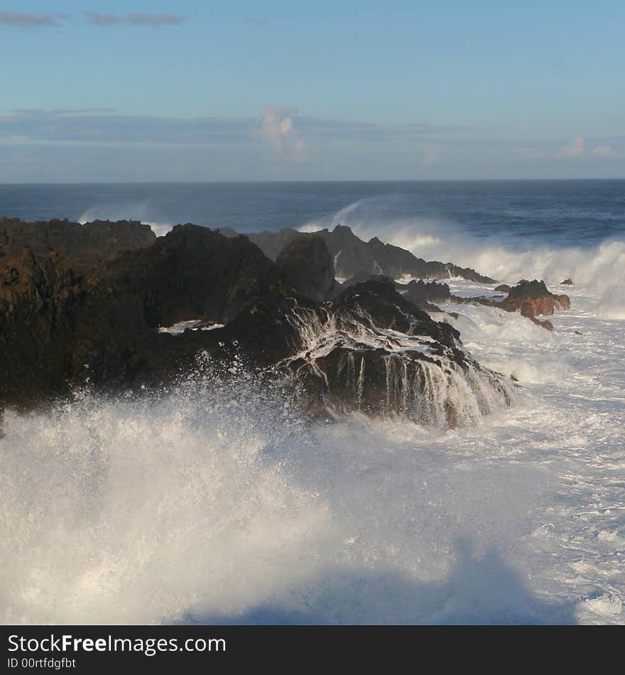 Rocky coastal rocks and great waves. Rocky coastal rocks and great waves