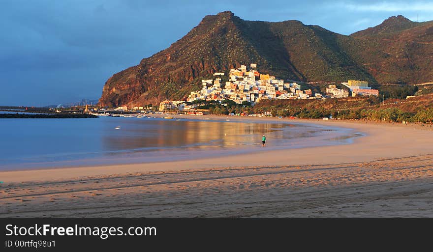 Sand beach with summer resort in the background. Sand beach with summer resort in the background