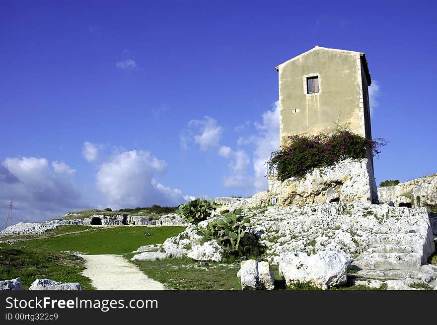 Old spanish house atop ancient greek ruins in italy