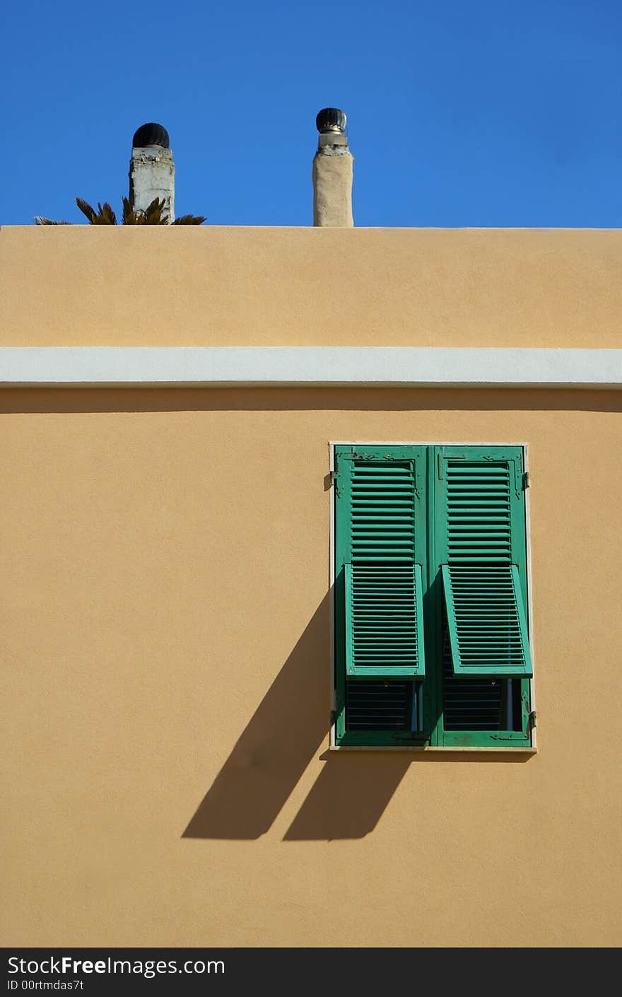 Green window opened, in the yellow house