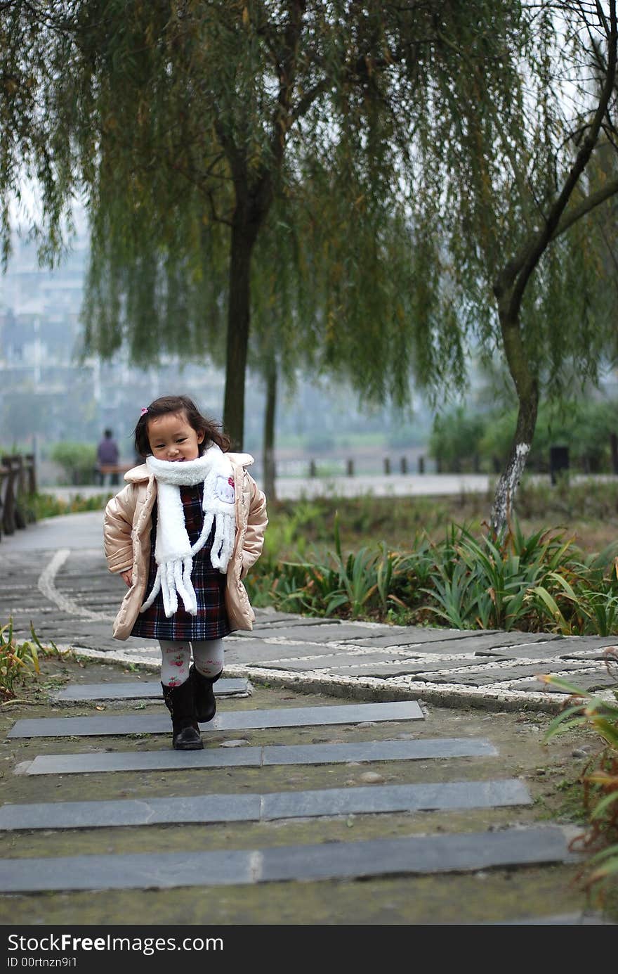 A beautiful girl walk as a model