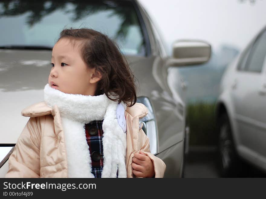 A beautiful girl near the car