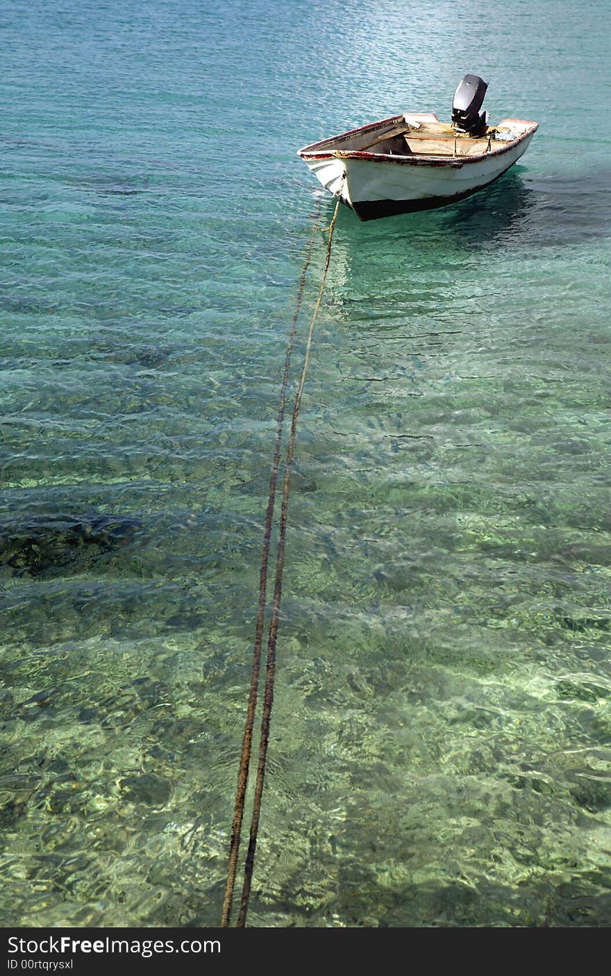 Old fishingboat on shallow water on Bonaire. Old fishingboat on shallow water on Bonaire