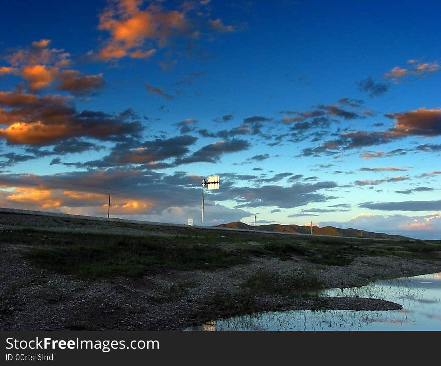 A highway at the dusk in the highland of Tibet. A highway at the dusk in the highland of Tibet.