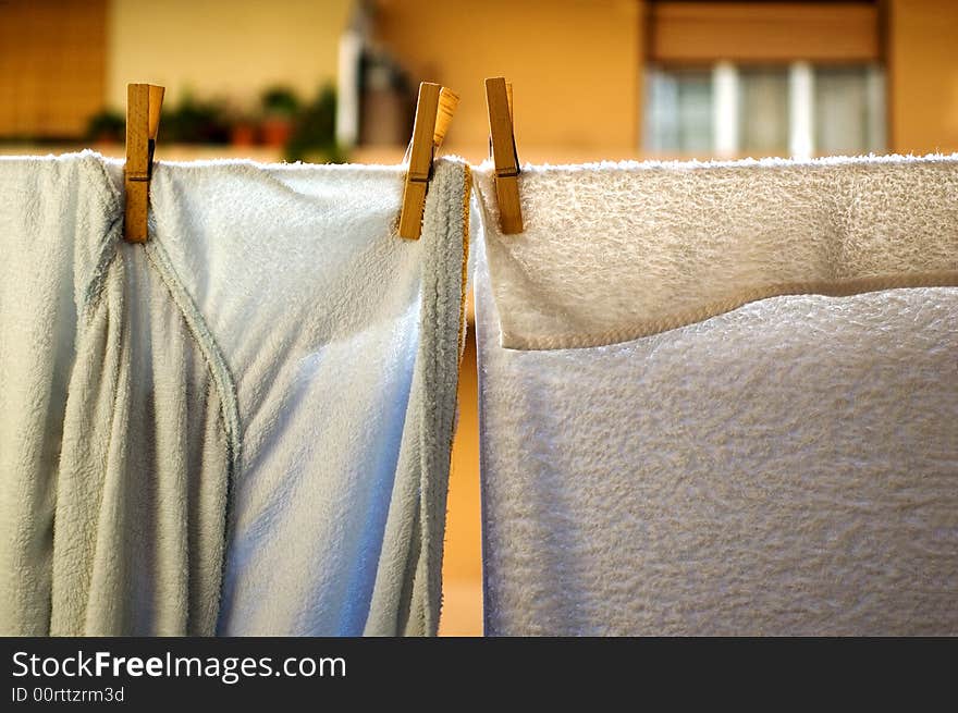 Bathrobe and towel hanging out to dry