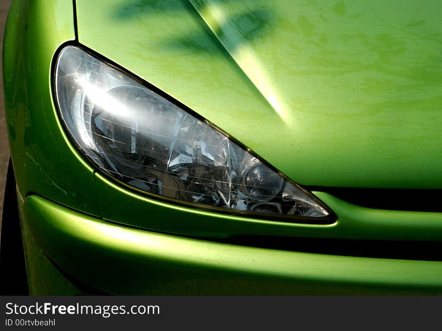 Headlight of a verdant car. Headlight of a verdant car.