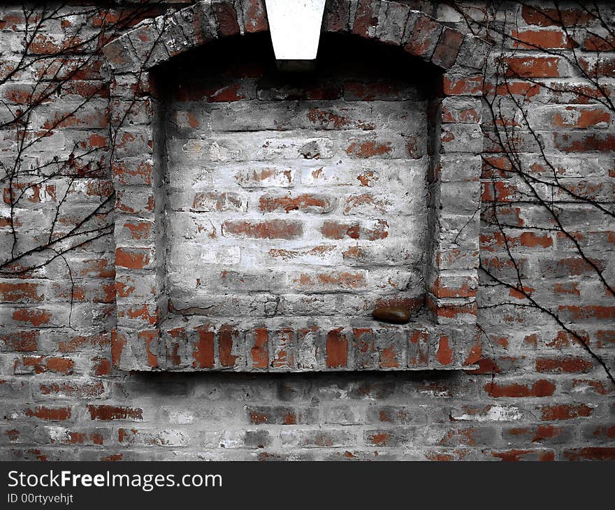 Old wall with a blind window.