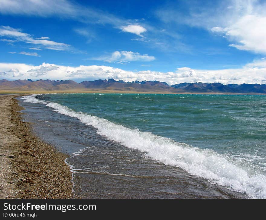 This photo is the scene of Namsto lake, Tibet, China. This lake is a holy site in Tibet buddhism tales. It's the the world's highest lake at an Altitude of about 4,700 metres (15,420 feet).