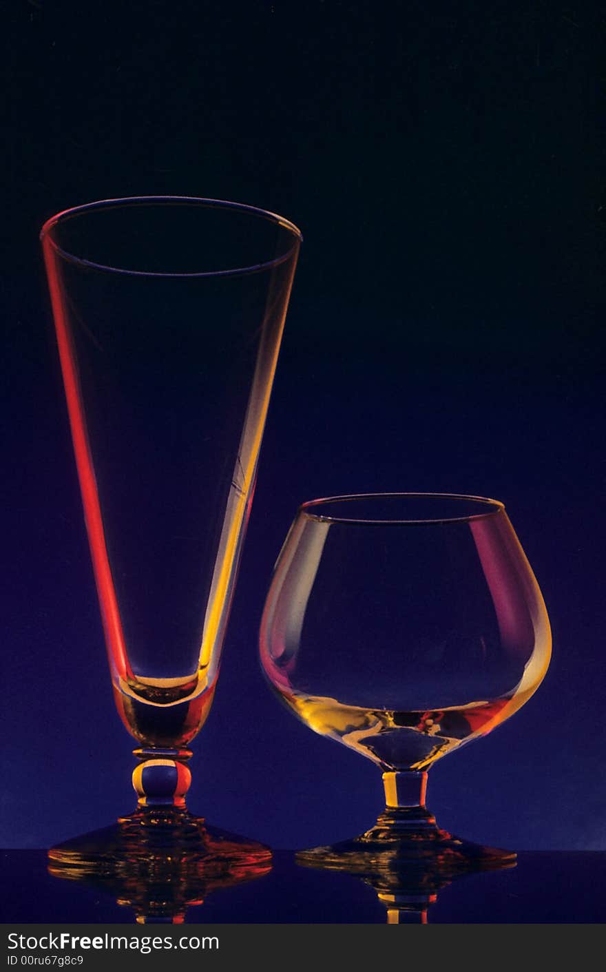 Two glasses waiting to be filled with liquor. Two glasses waiting to be filled with liquor