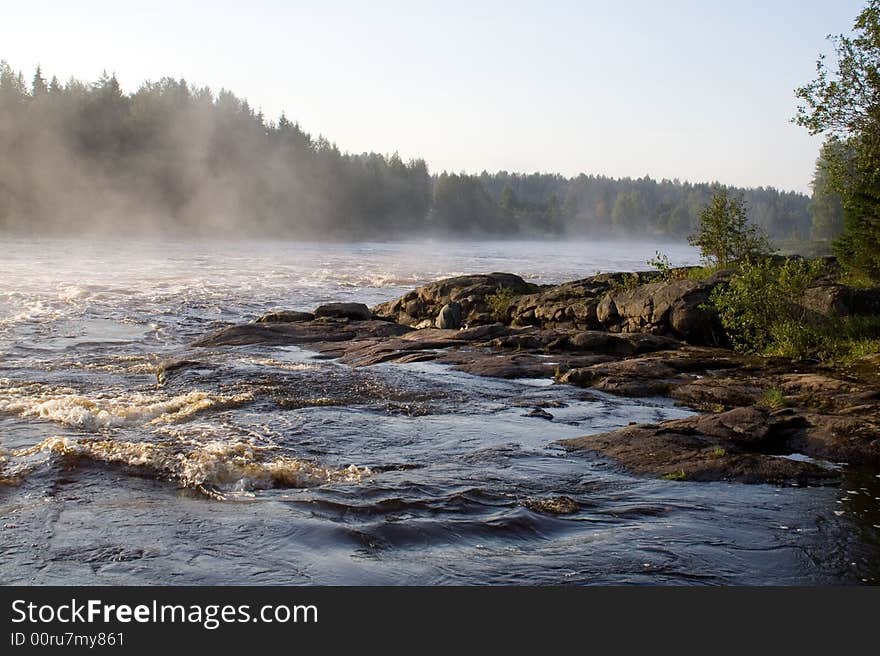August foggy morning: river, forest, rock
