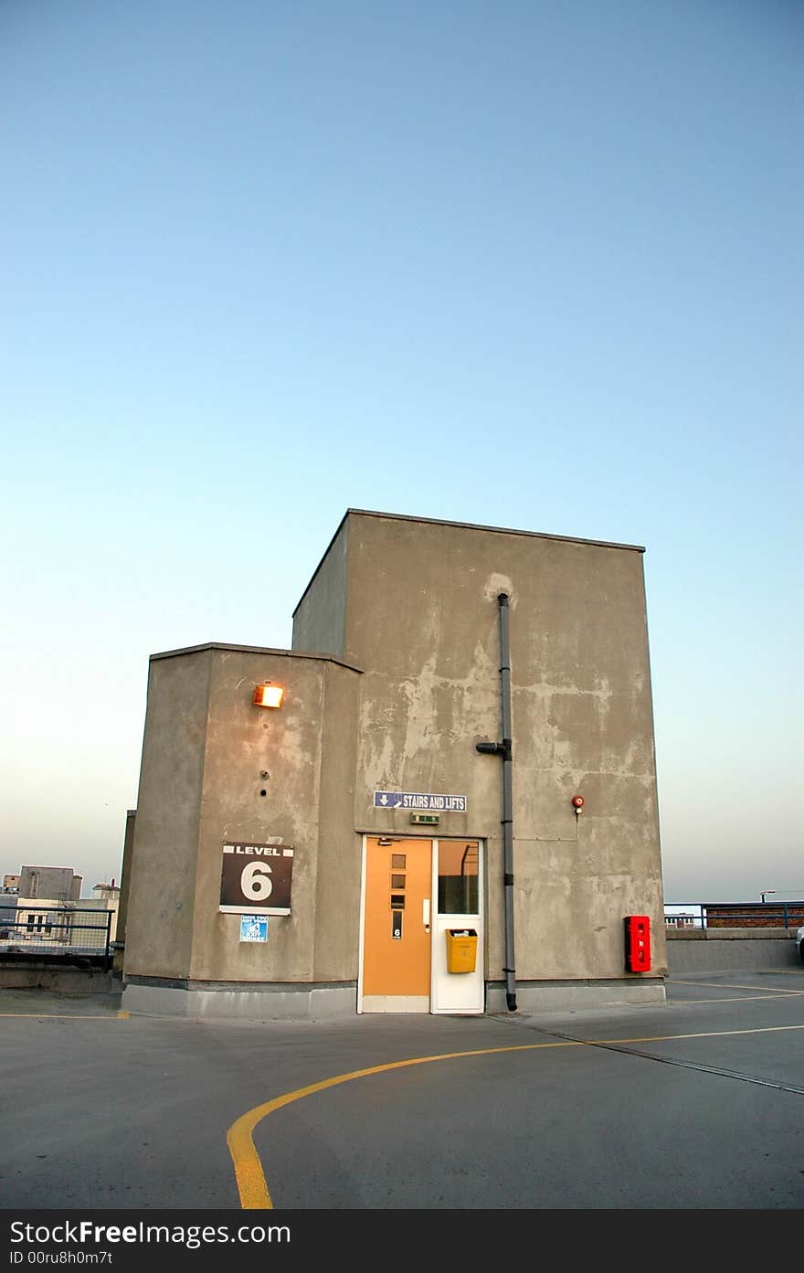 Car Park Stair well and lifts in gentle evening light with big sky. Car Park Stair well and lifts in gentle evening light with big sky