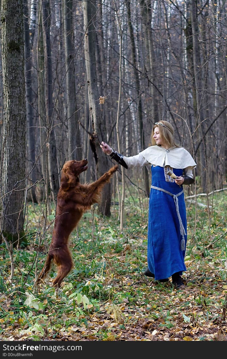 Portrait of the girl and irish setter in autumn forest. Portrait of the girl and irish setter in autumn forest.