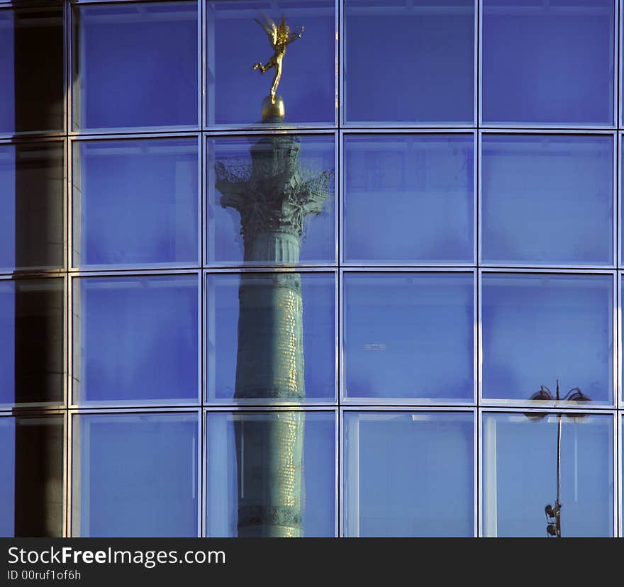 France, Paris: nice view of the bastille column reflected on the opera windows.