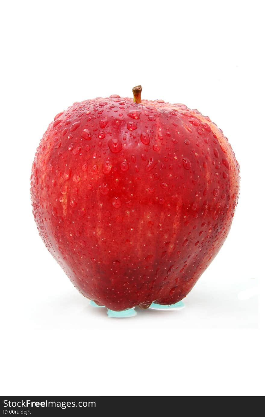 Red wet apple on white. Red wet apple on white