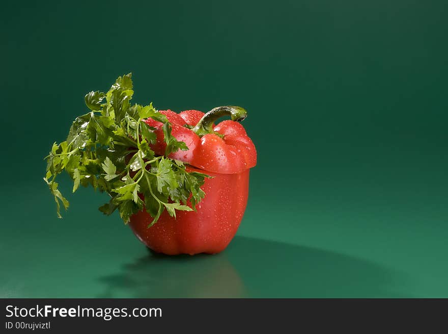 Red pepper and parsley over green.