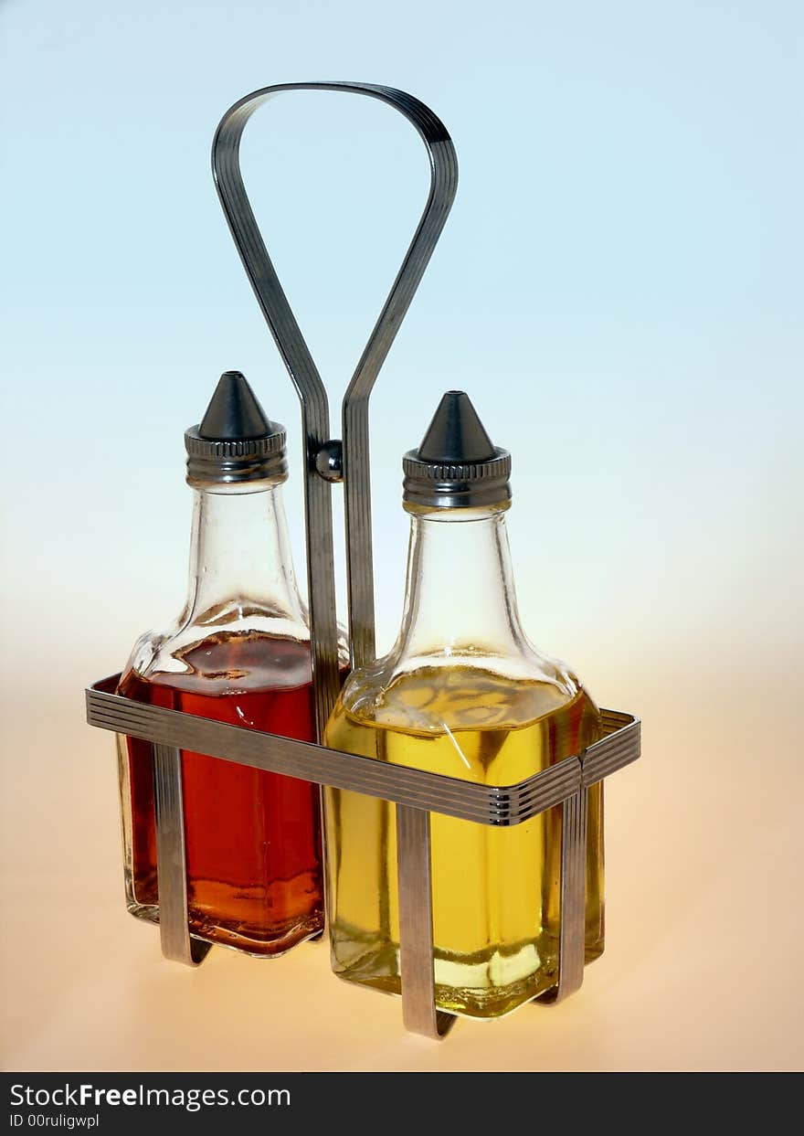 Oil and Vinegar Bottles in Metal Rack