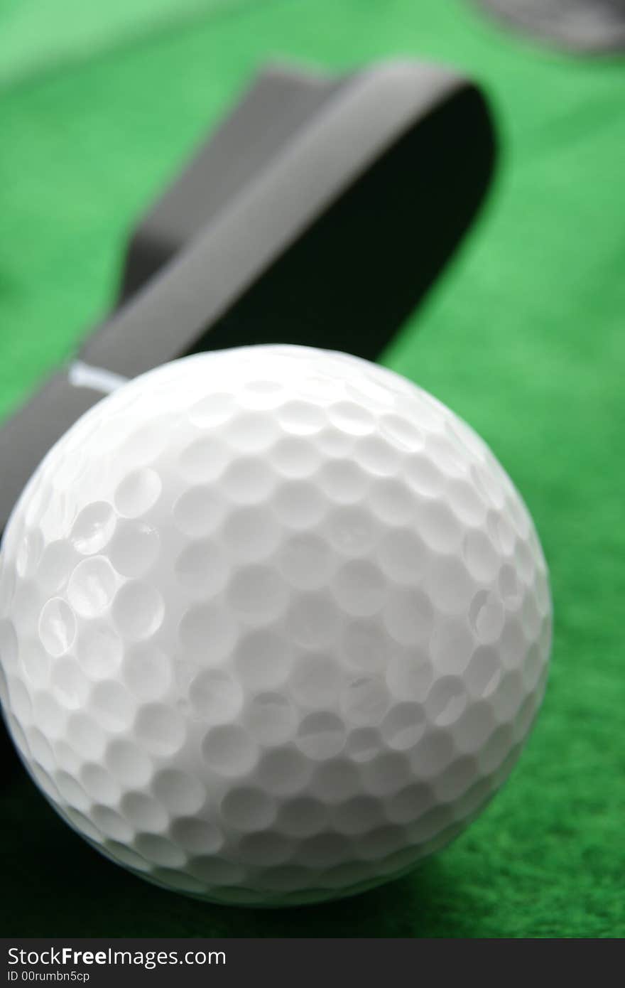 Golf ball. Iron hitting golf ball in motion